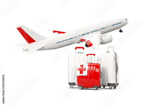 Luggage with flag of tonga. Three bags with airplane © Mikhail Mishchenko