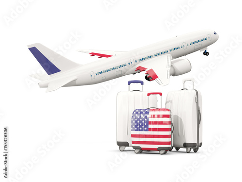 Luggage with flag of united states of america. Three bags with airplane