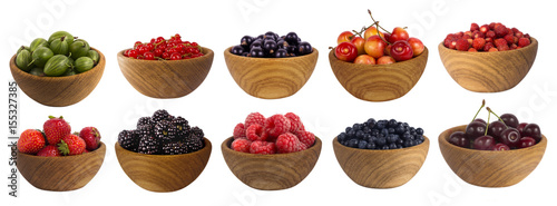 different berries isolated on white background. Collage of fruits and berries: blueberry, blackberry, cherry, strawberry, currant and raspberry. Collection of fruits and berries in a bowl.