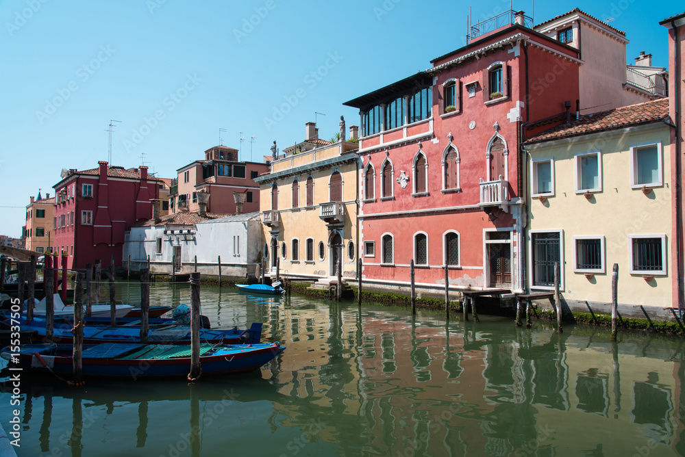 Reflections along the canals of Chioggia, Venice and its lagoon.