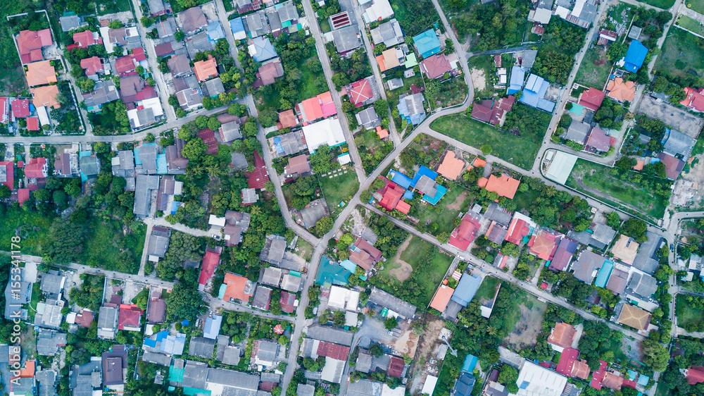 Aerial view of residential houses and driveways. Aerial view of residential houses and driveways.