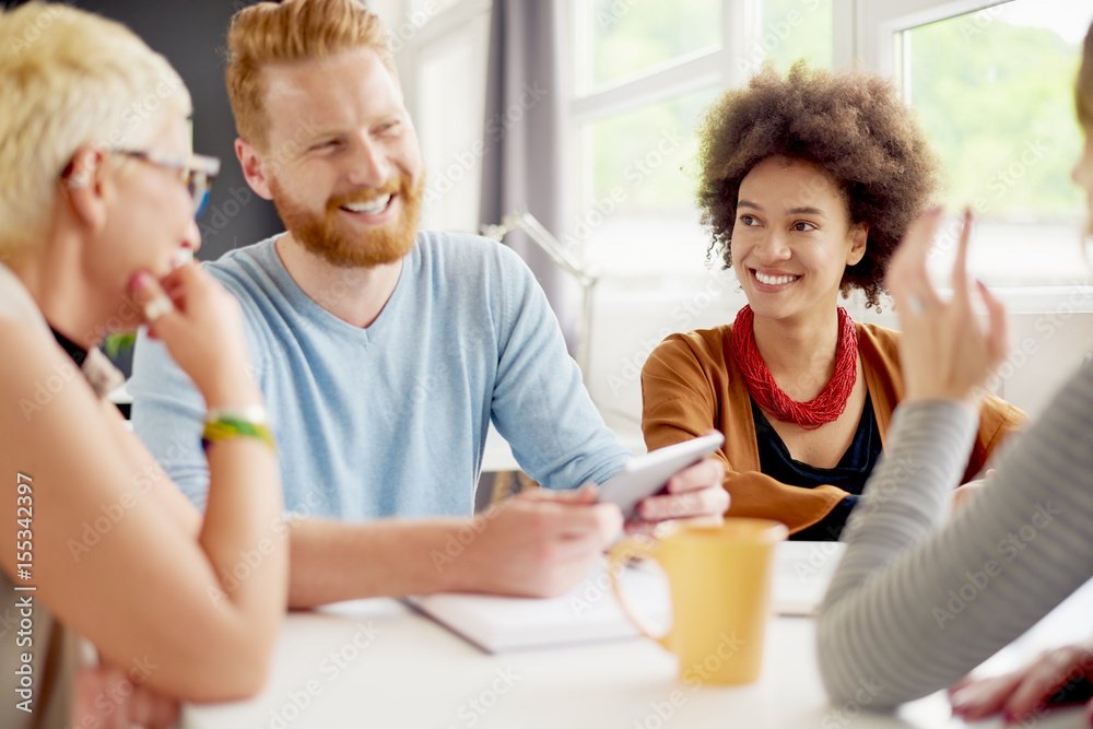 Multi-ethnic group having a meeting or presentation in modern office Multi-ethnic group having a meeting or presentation in modern office