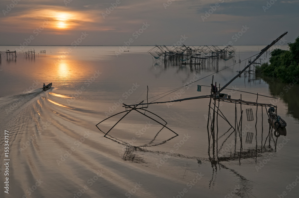 Giant square dip net fishing gear and fisherman at Pakpra, Phatthalung, Thailand.