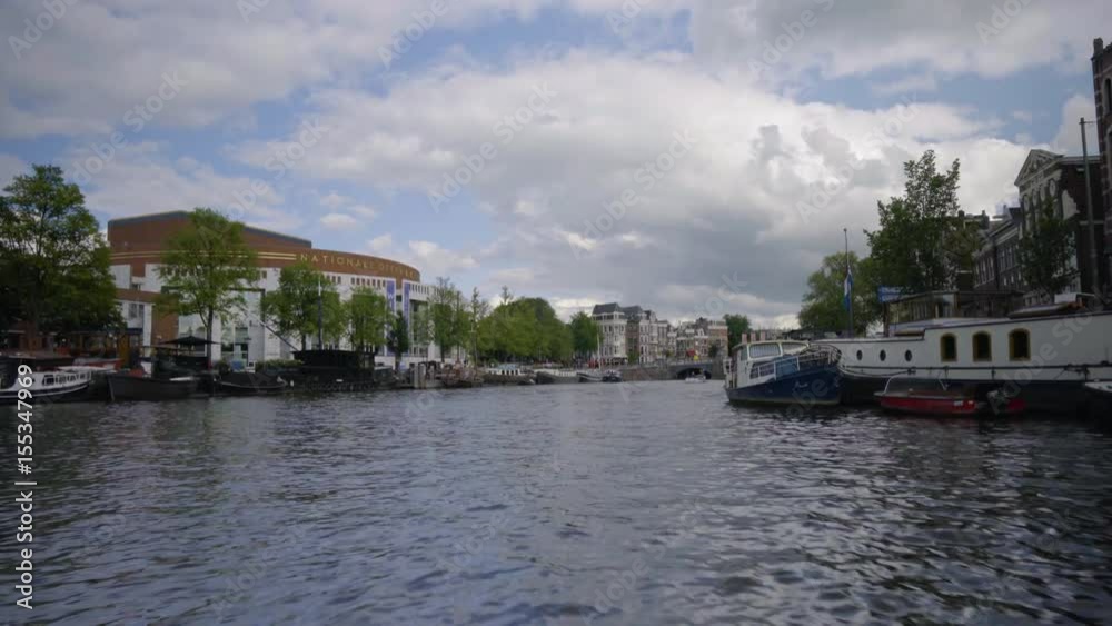 Scenic View Of Canal, From Motor Boat, Amsterdam, Netherlands Scenic View Of Canal, From Motor Boat, Amsterdam, Netherlands