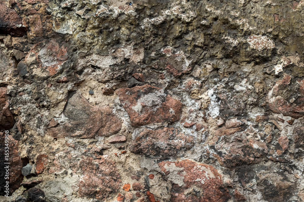 Wallpaper granite stones in cement . Pattern grey red style vintage rough round decorative real stone wall surface with cement. Wallpaper granite stones in cement . Pattern grey red style vintage rough round decorative real stone wall surface with cement.