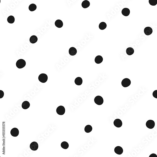 Chaotically scattered round spots. Seamless pattern.