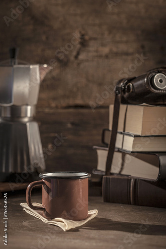 Coffee cup with books at the background