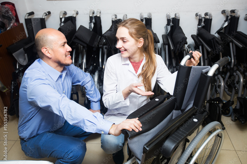 Fototapeta premium Specialist consulting client about wheelchairs