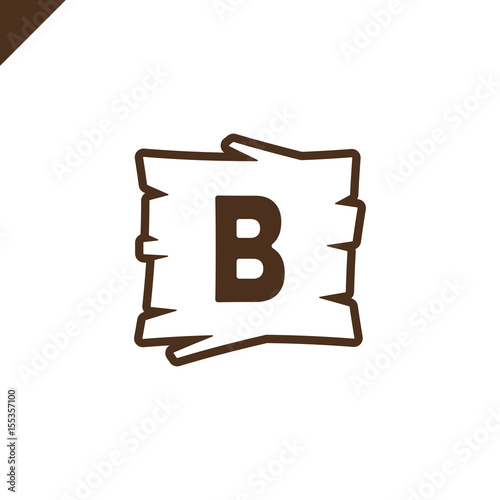 Wooden alphabet or font blocks with letter b in wood texture area with outline.