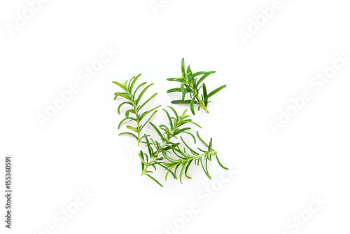 Fresh branches with leaves of organic rosemary seen from above isolated on a white background © ydumortier