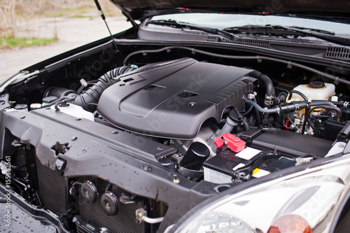 The new off-road vehicle's engine V8 is covered with plastic photo