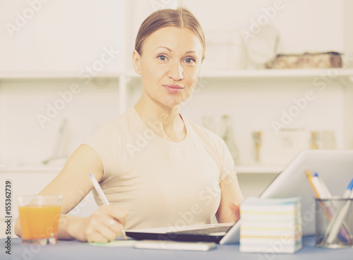 Woman concentrating on work on laptop