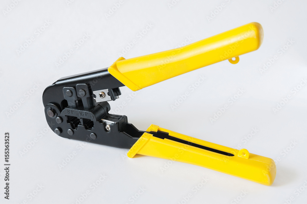 Crimping tool with yellow handles on white background. Crimping pliers closeup Crimping tool with yellow handles on white background. Crimping pliers closeup