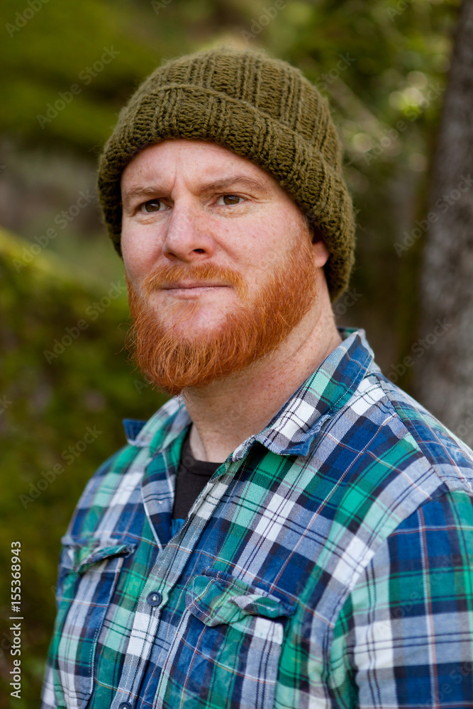 Portrait of a hipster guy thinking in the forest Portrait of a hipster guy thinking in the forest