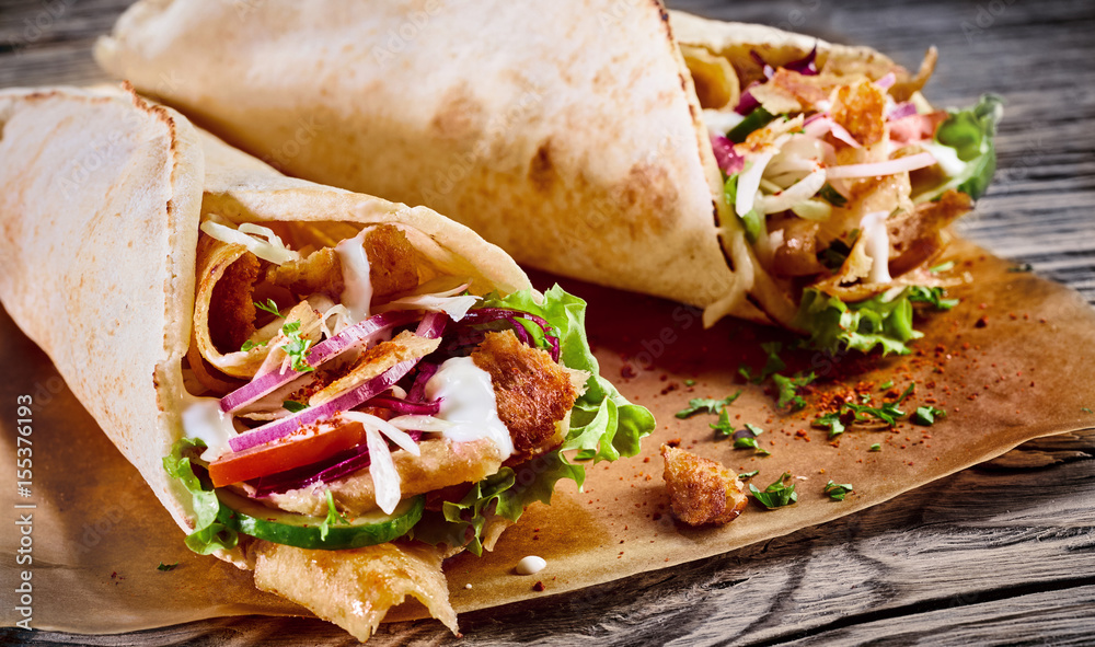 Doner kebab in a tortilla wrap ภาพถ่ายสต็อก Adobe Stock