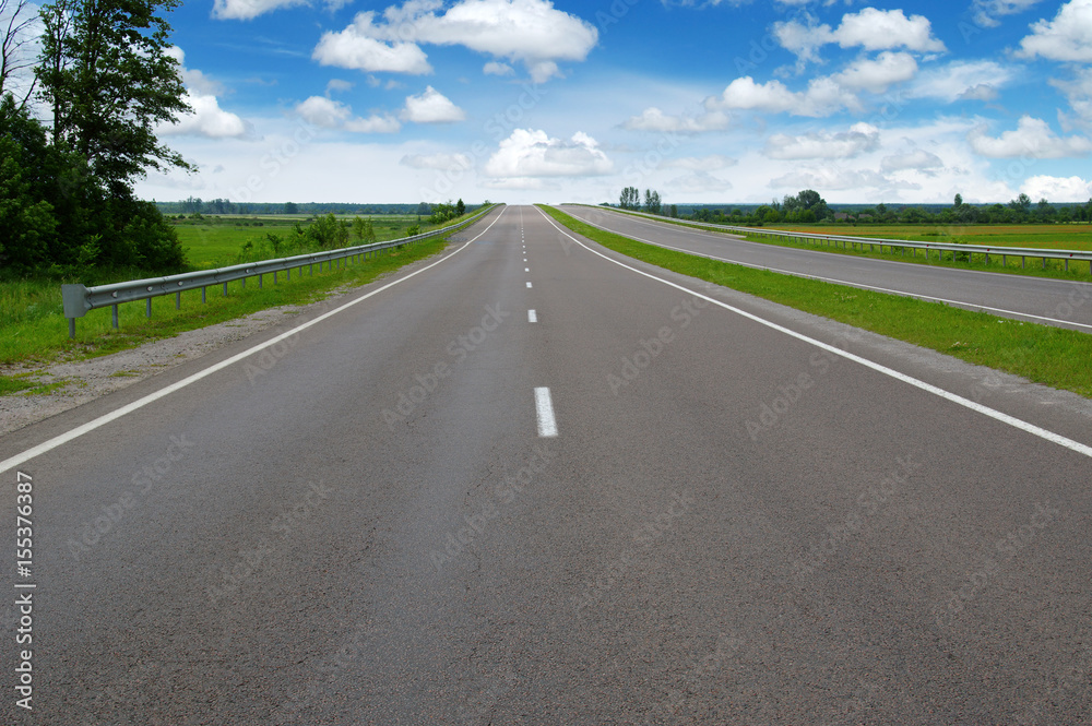 Asphalt road and clouds