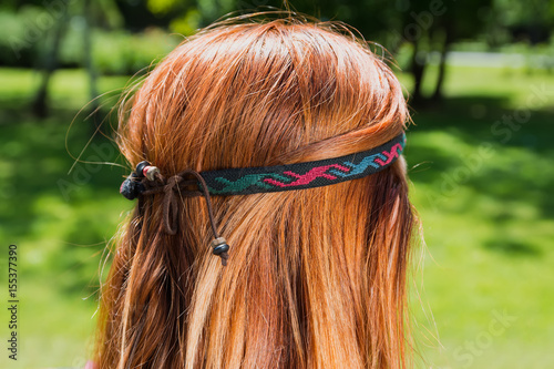 Closeup of beautiful hair accessories over red hair.