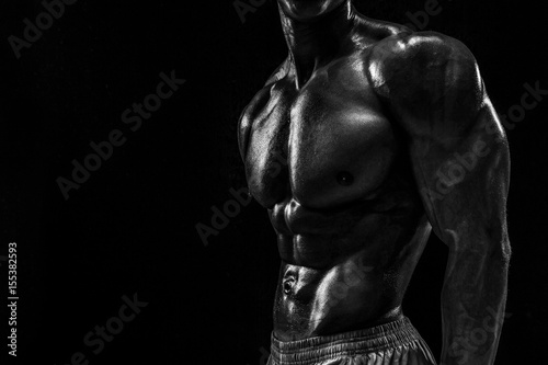 Part of a man's body on a dark background with copyspace