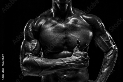 Part of a man's body on a dark background with copyspace © nazarovsergey