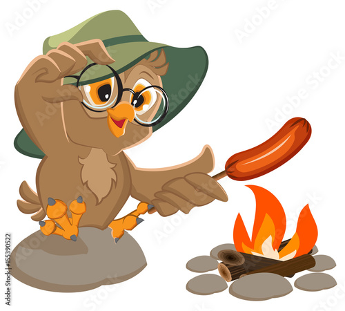 Picnic owl scout frying sausage on fire