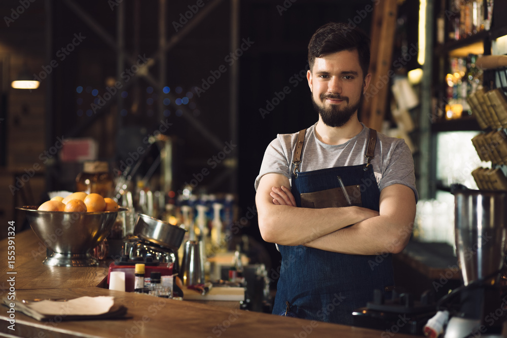Bartender standing at bar Bartender standing at bar