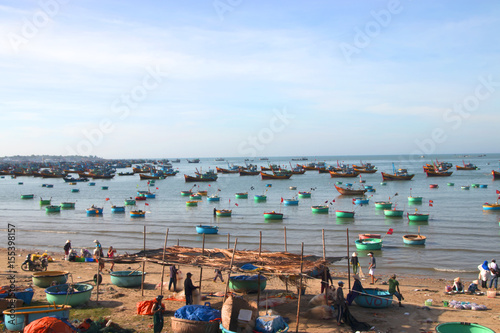 Fototapeta Naklejka Na Ścianę i Meble -  Vietnamese fishing village, Mui Ne, Vietnam, Southeast Asia.in February 23, 2017. Landscape with sea and traditional colorful fishing boats