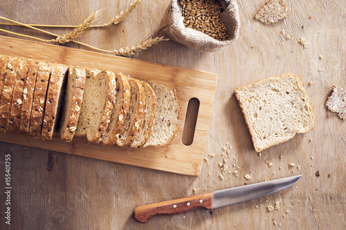 Sliced toast bread on wooden table photo