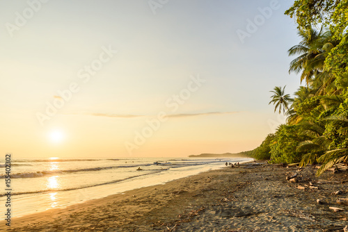 Fototapeta Naklejka Na Ścianę i Meble -  Sunset at paradise beach in Uvita, Costa Rica - beautiful beaches and tropical forest at pacific coast of Costa Rica - travel destination in central america