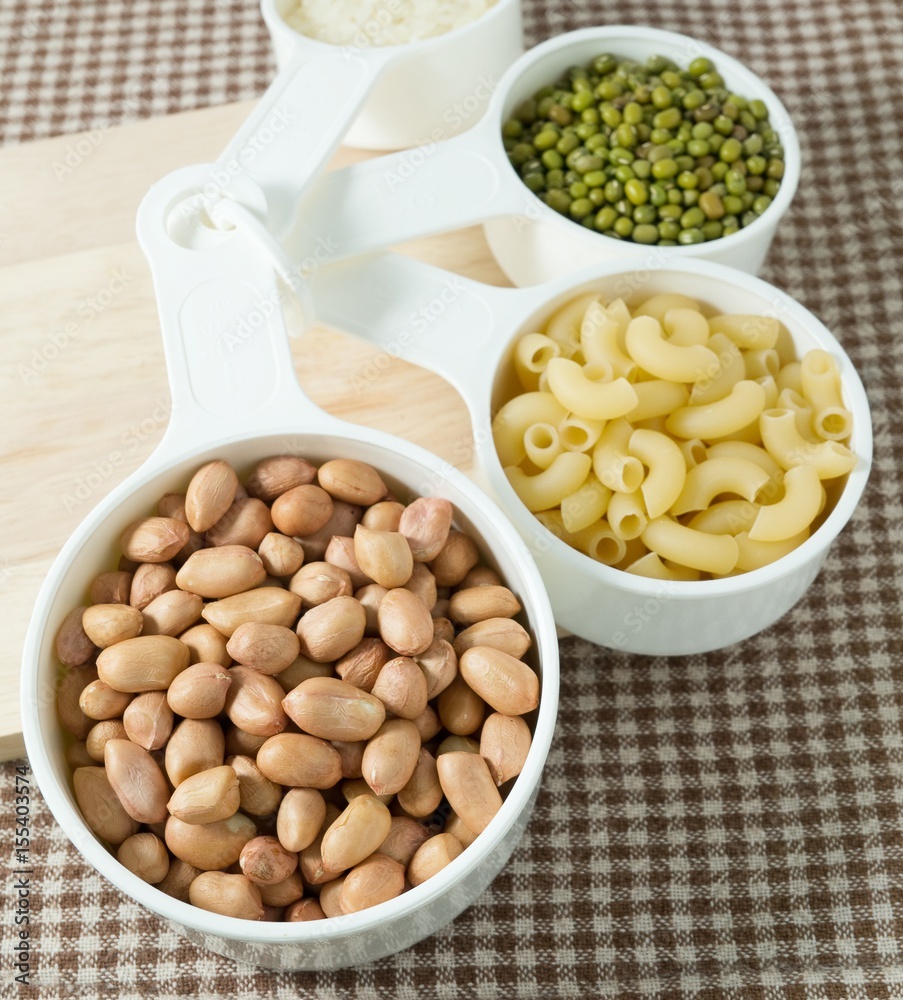 Pasta, Rice, Peanuts and Mung Beans in Measuring Spoons Pasta, Rice, Peanuts and Mung Beans in Measuring Spoons