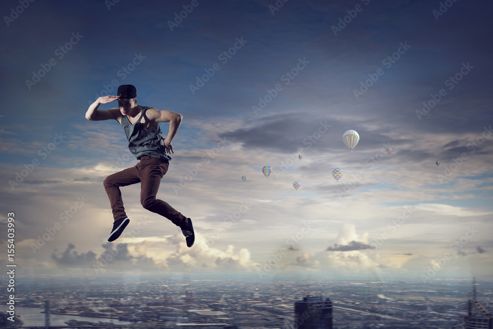 B-boy performing some moves . Mixed media