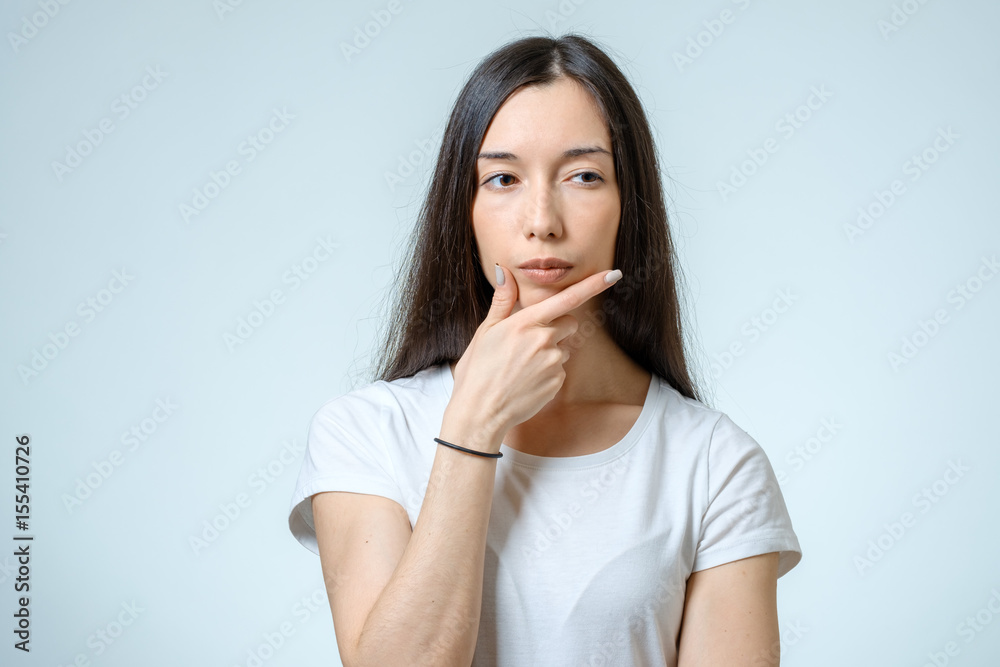 Portrait of beautiful young confident woman with serious expression Portrait of beautiful young confident woman with serious expression