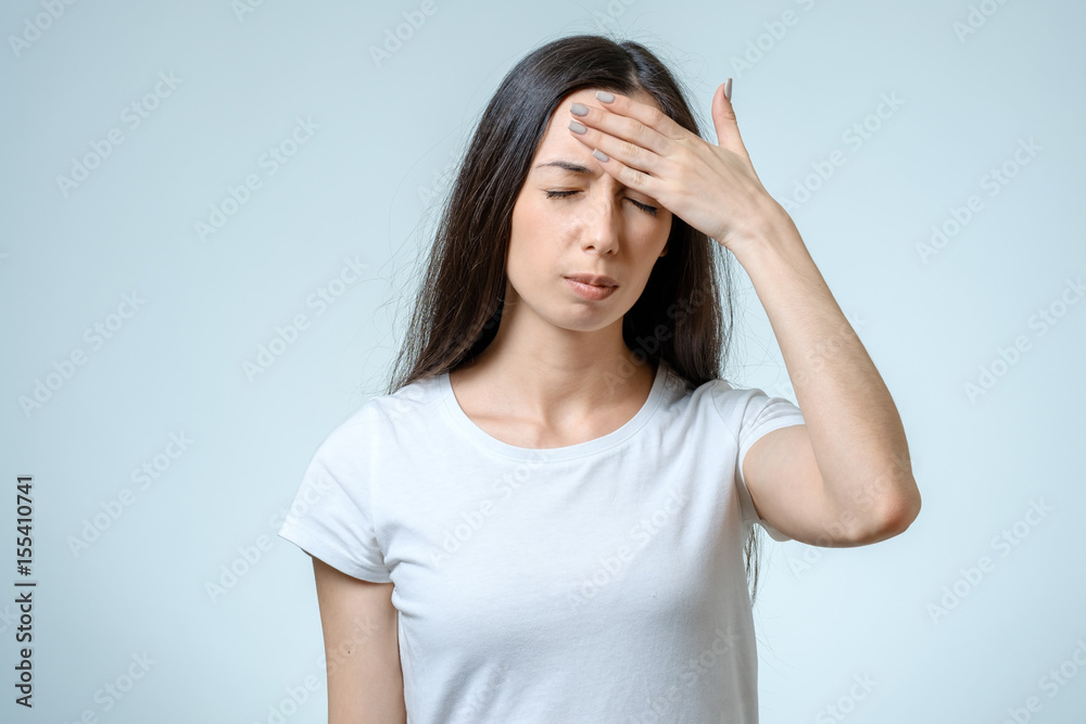 Portrait of depressed woman touching her head Portrait of depressed woman touching her head