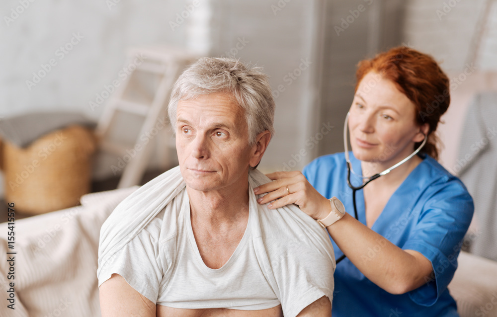 Attractive senior man undergoing professional medical examination Attractive senior man undergoing professional medical examination