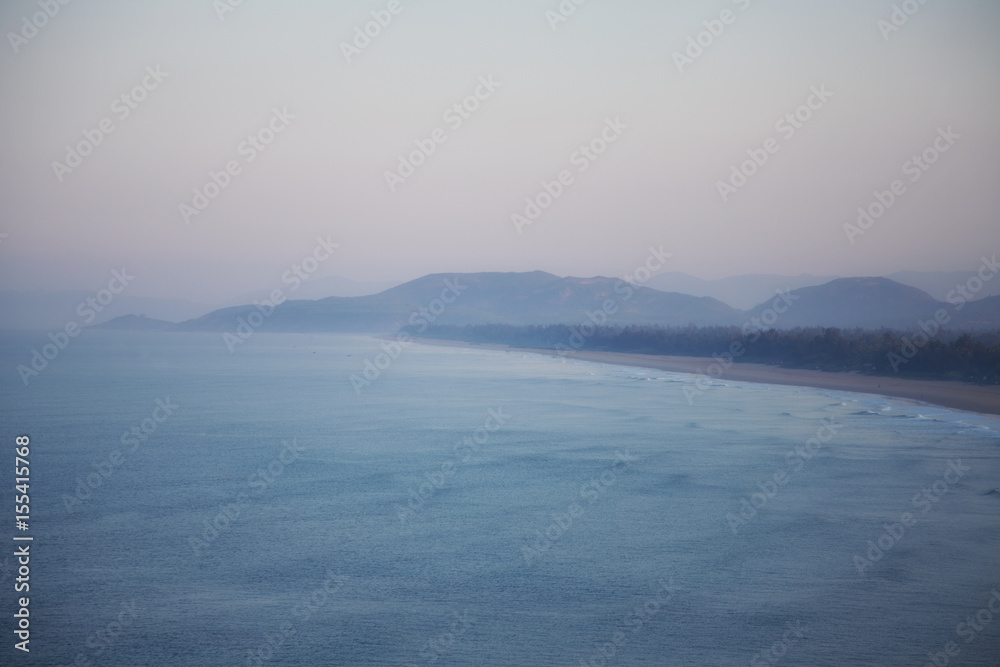 Fototapeta premium A view from above on a sandy beach and mountains