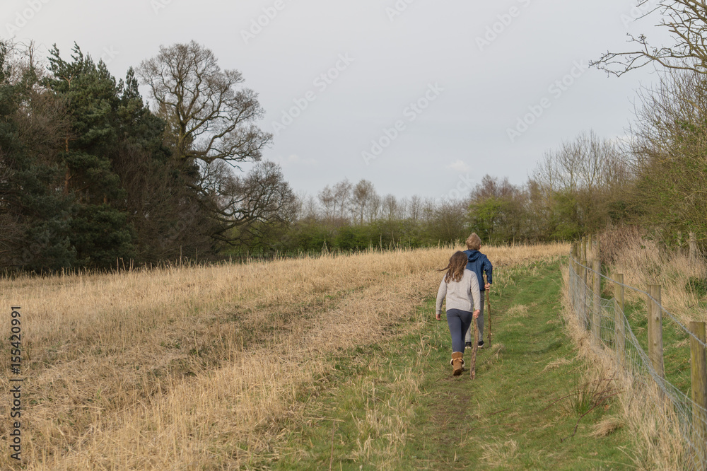 Young kids walking in the countryside
