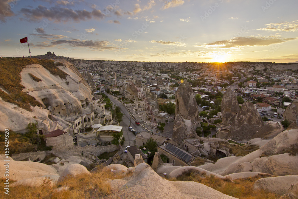 sunset in cappadocia city with sand hills, turkey