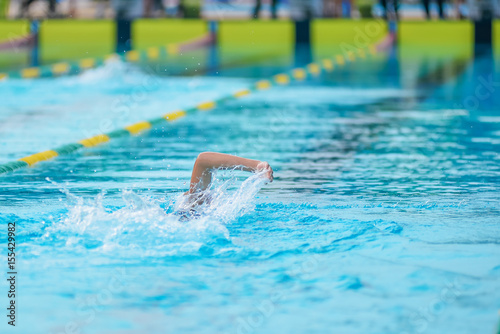 Swimming in the pool is not identifiable.