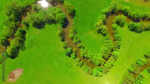 Aerial view to rural landscape with Uhlava river and fish pond. Luzany village near Pilsen in Czech Republic. Spring in Central Europe. photo