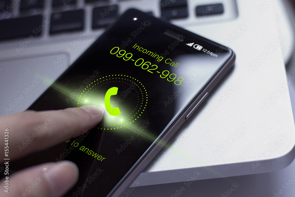 Hand pressing incoming call icon on smartphone