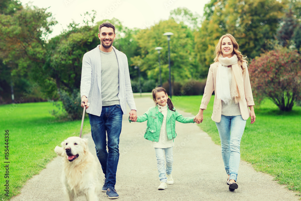 happy family with labrador retriever dog in park happy family with labrador retriever dog in park