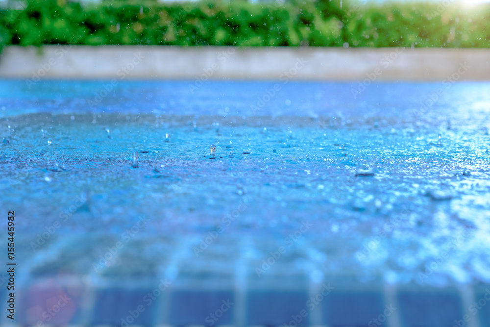 Heavy rain in the blue swimming pool