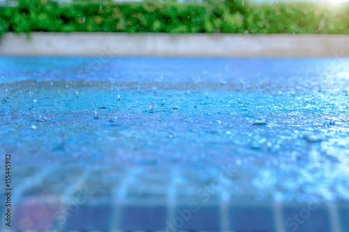 Heavy rain in the blue swimming pool