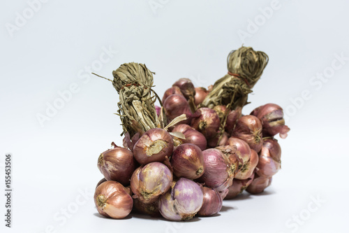 Group of red onion on white background,selective focus.