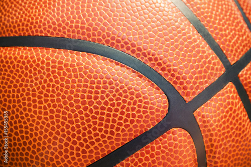 Closeup detail of basketball ball texture background © myfotolia88