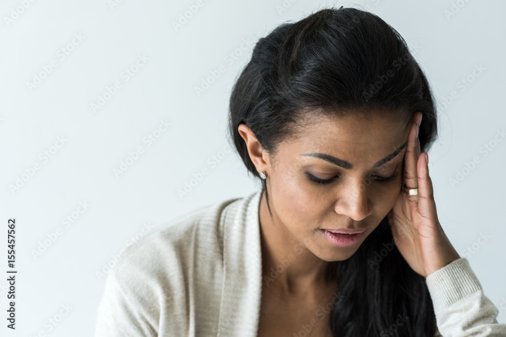 attractive african american woman with headache isolated on white attractive african american woman with headache isolated on white