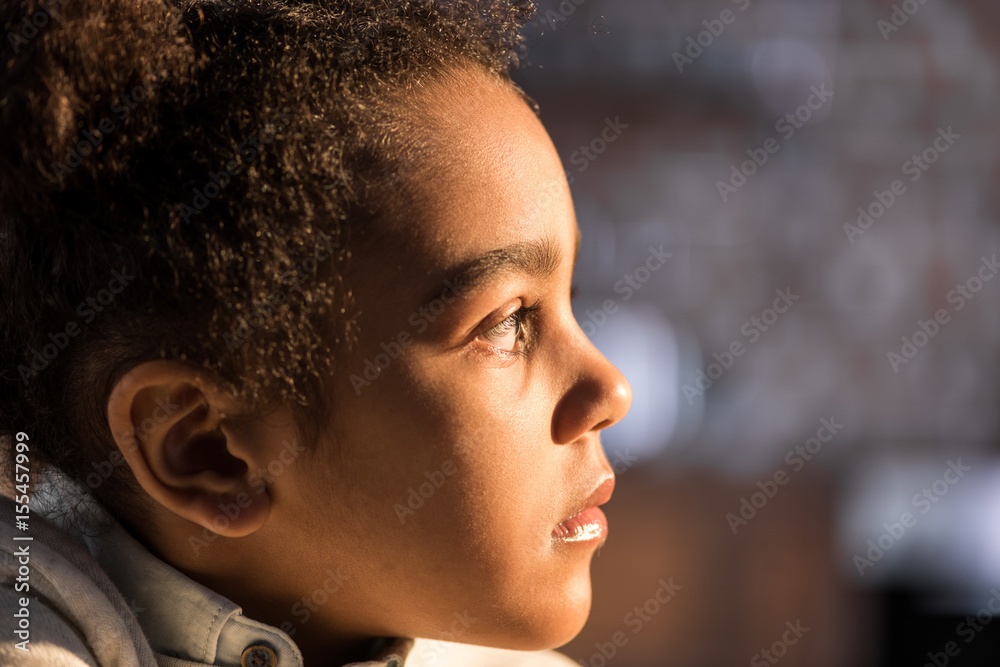 Close-up profile portrait of adorable african american girl looking away Close-up profile portrait of adorable african american girl looking away