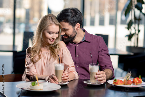 romantic couple in love spending time together on coffee break in restaurant