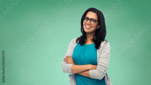 happy smiling young indian woman in glasses