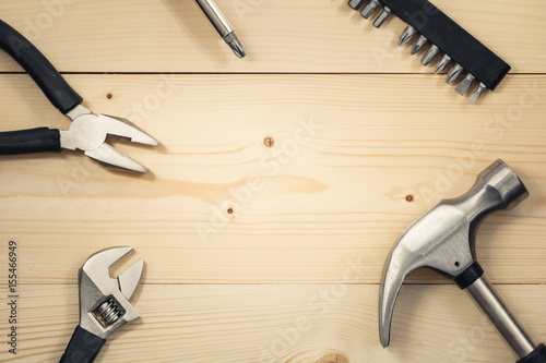 Work tools on a wooden table. Flat lay. Copy space. Color toning.