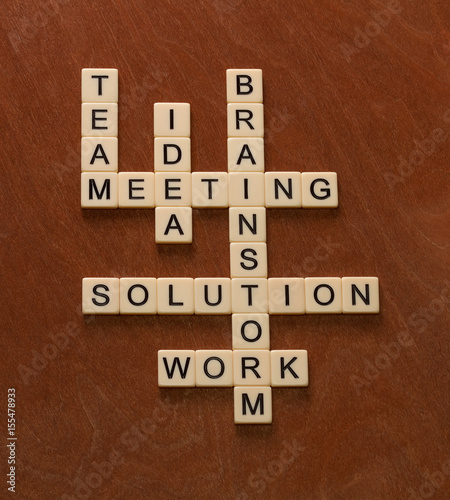 Crossword puzzle with words Team, Brainstorm, Solution, Idea. Problem solving concept.